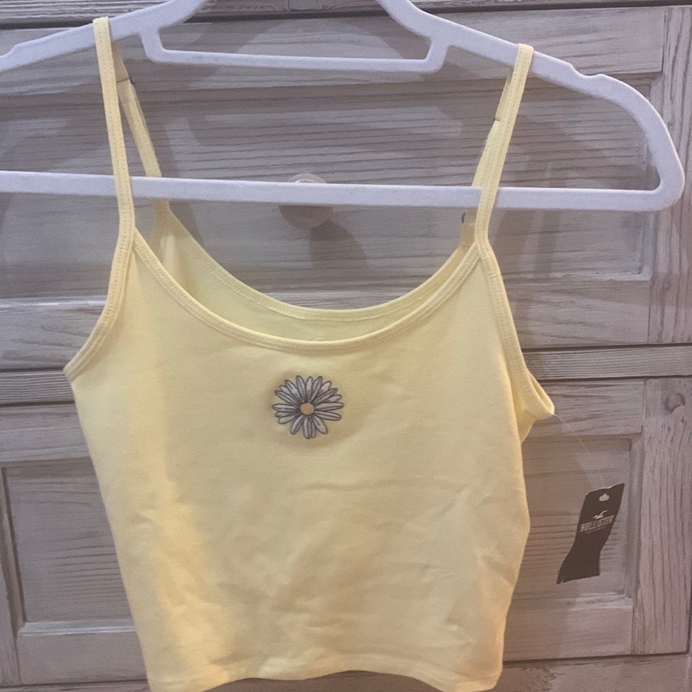 yellow tank top with a flower